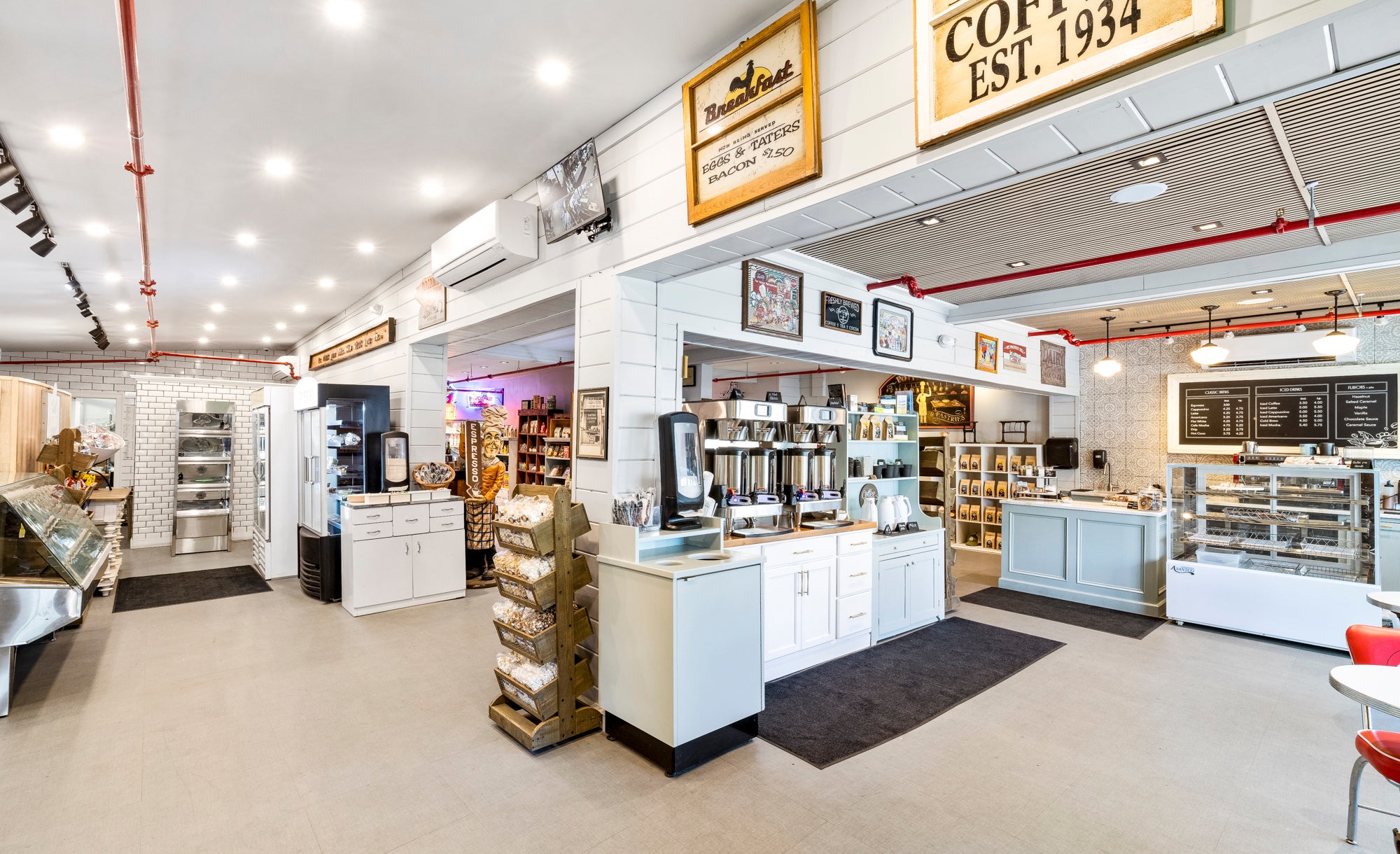 An interior of a room shows counters and foods.