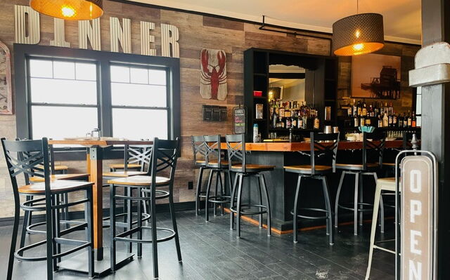 Dinner's interior includes a bar and tables