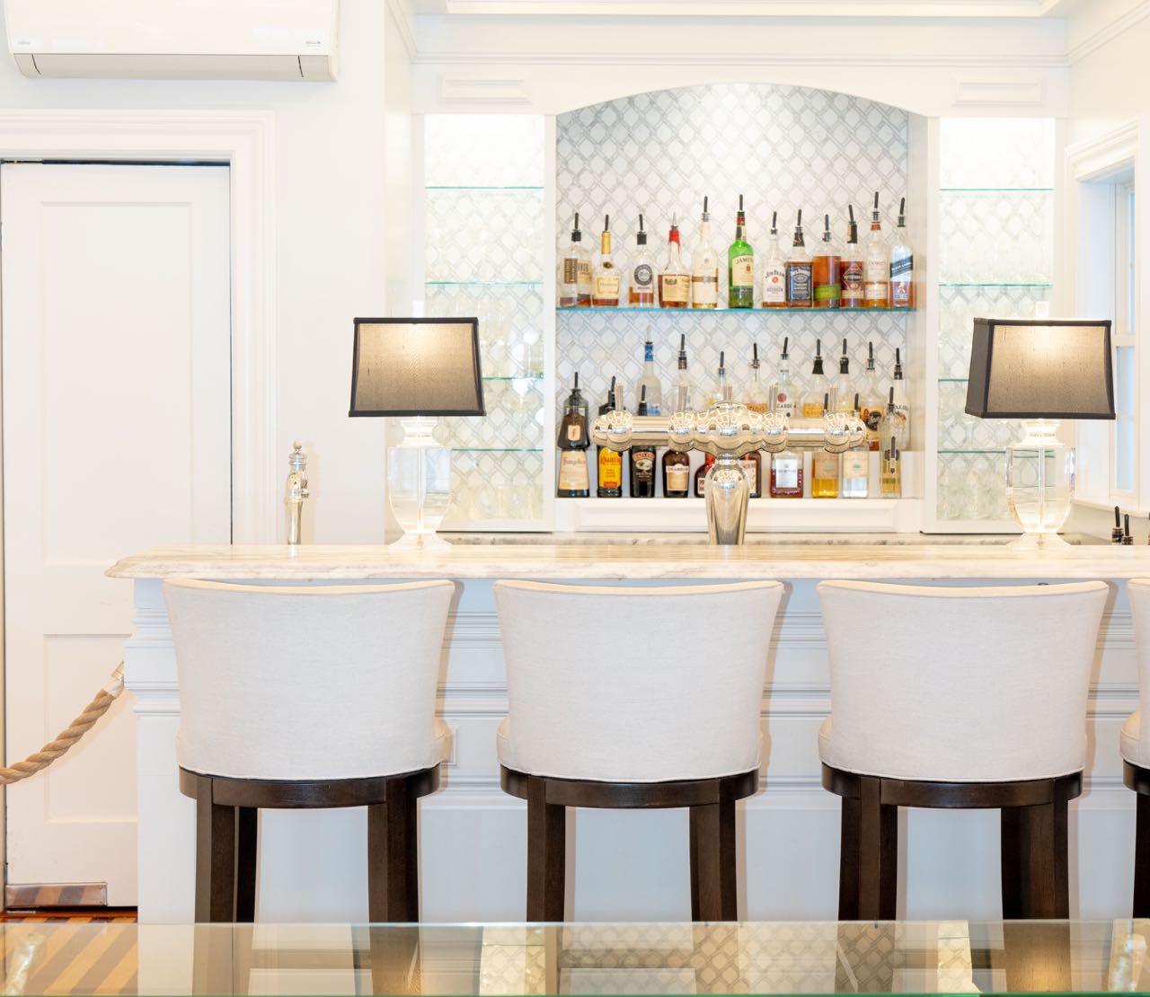 A room is mostly full of white paint and furnishings.