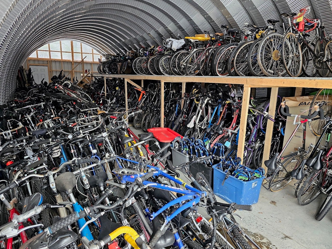 A Qunoset hut is full of bikes.