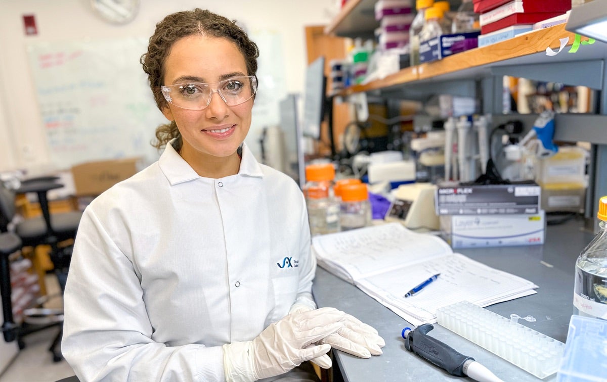 A person site at a lab work table.