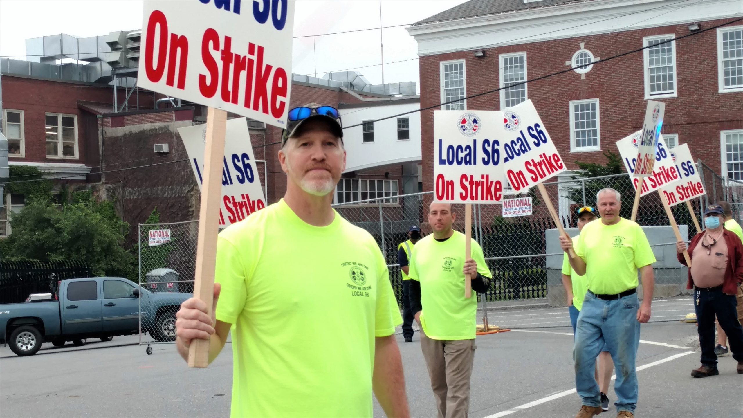 man with picket sign