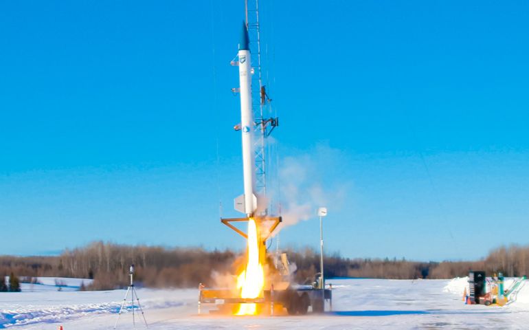 rocket blasting off from snowy field