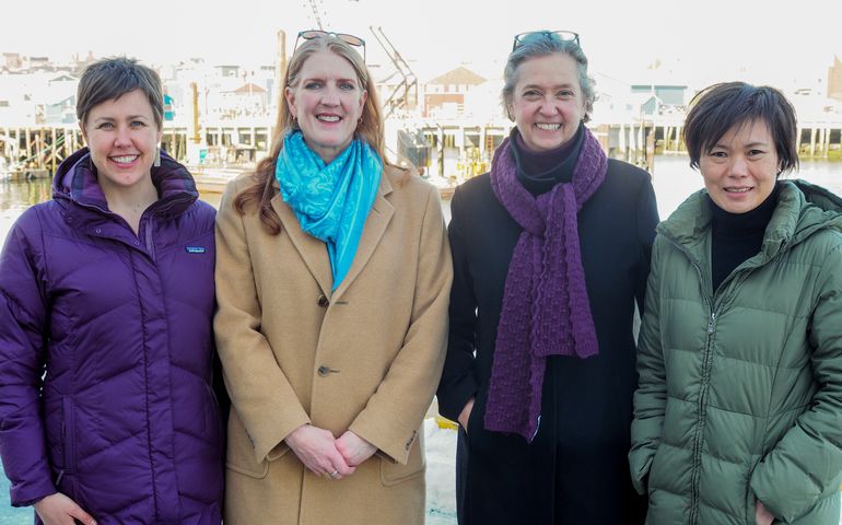 Photo of four women standing