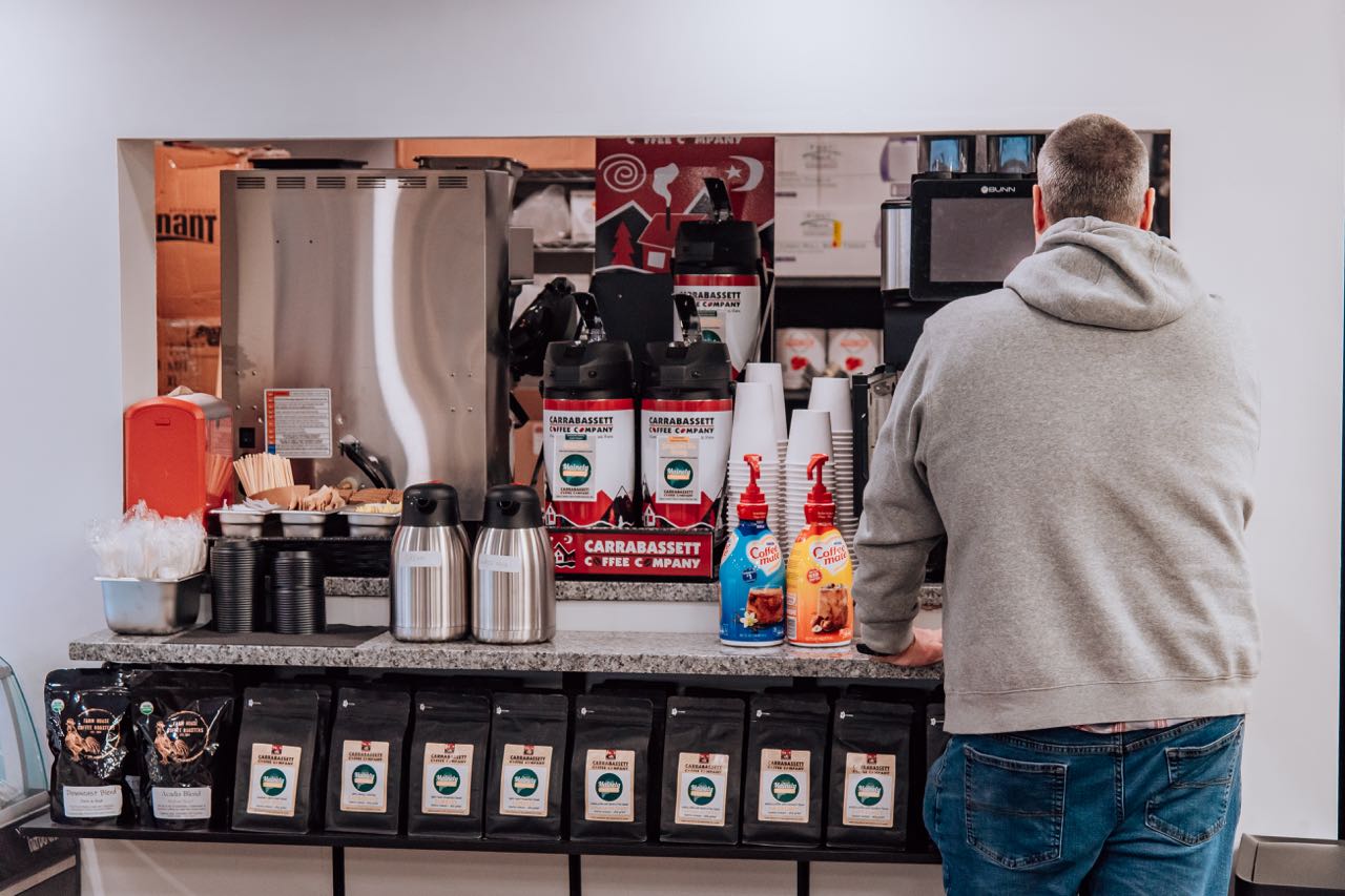 Coffee products are set up on a counter.