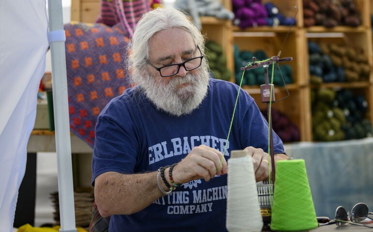 Man spinning yarn