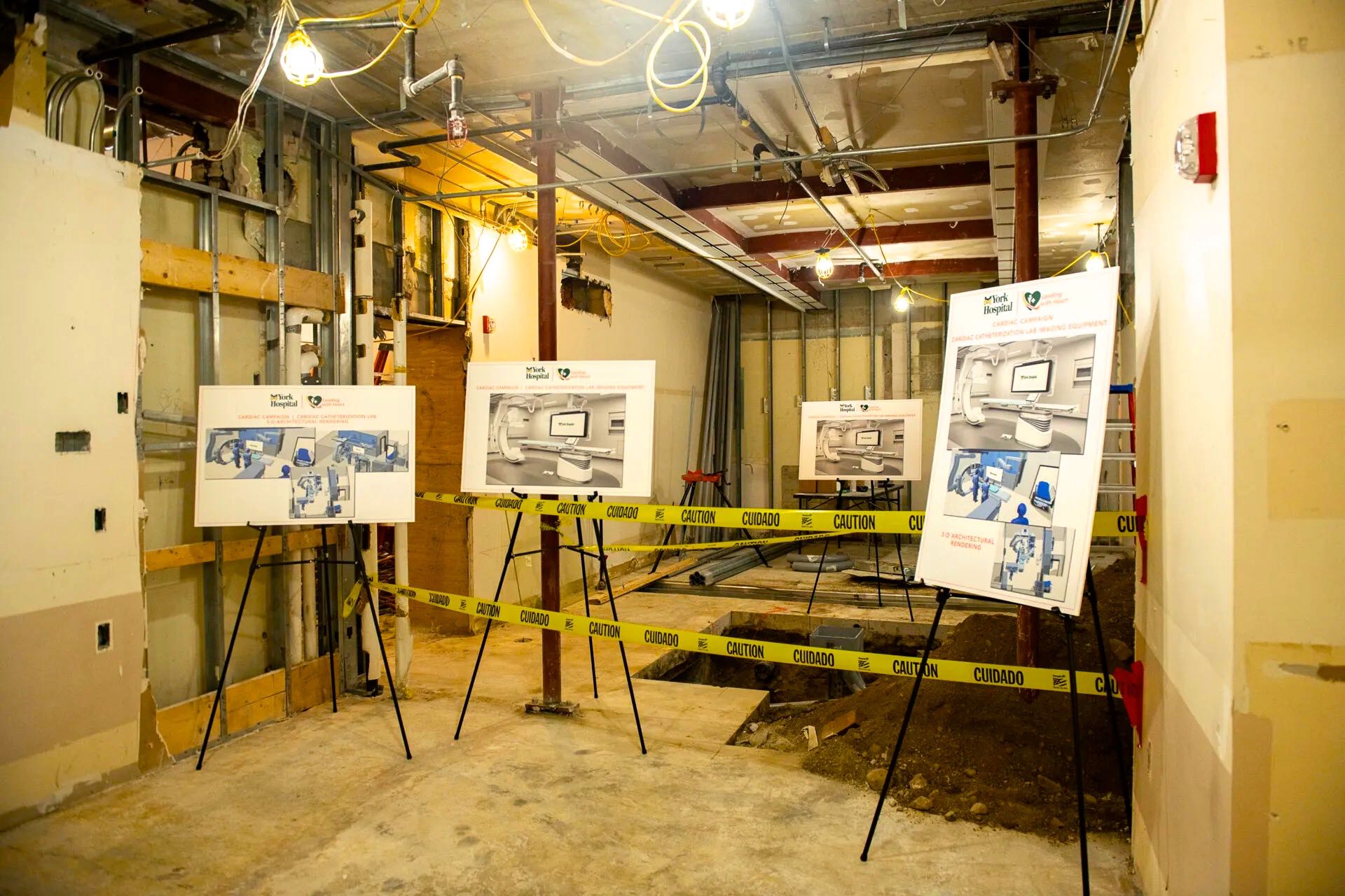 A space is under construction and has posters on easels.