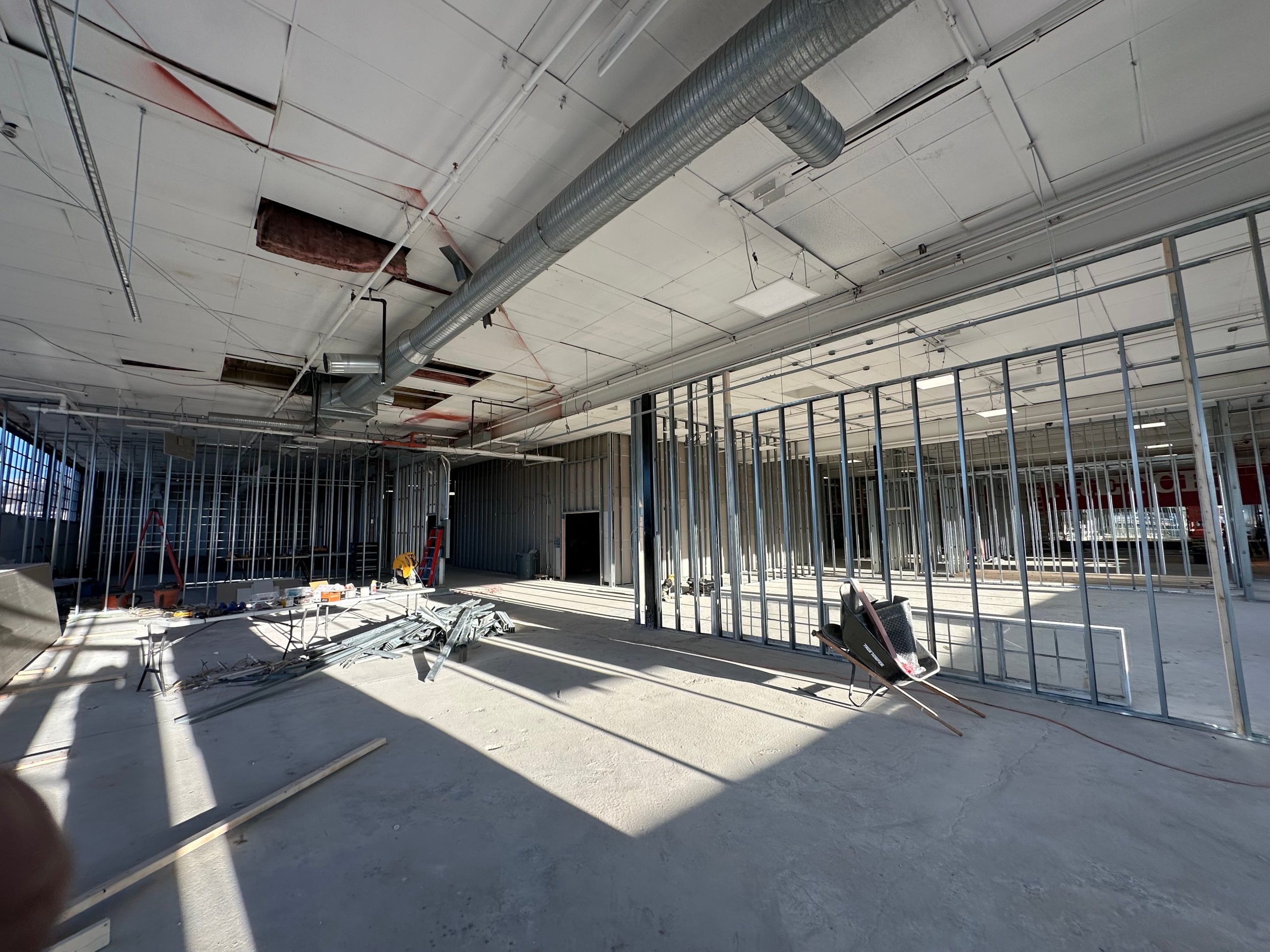 The interior of a big space is under construction.