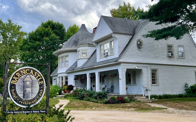 shingled building and sign