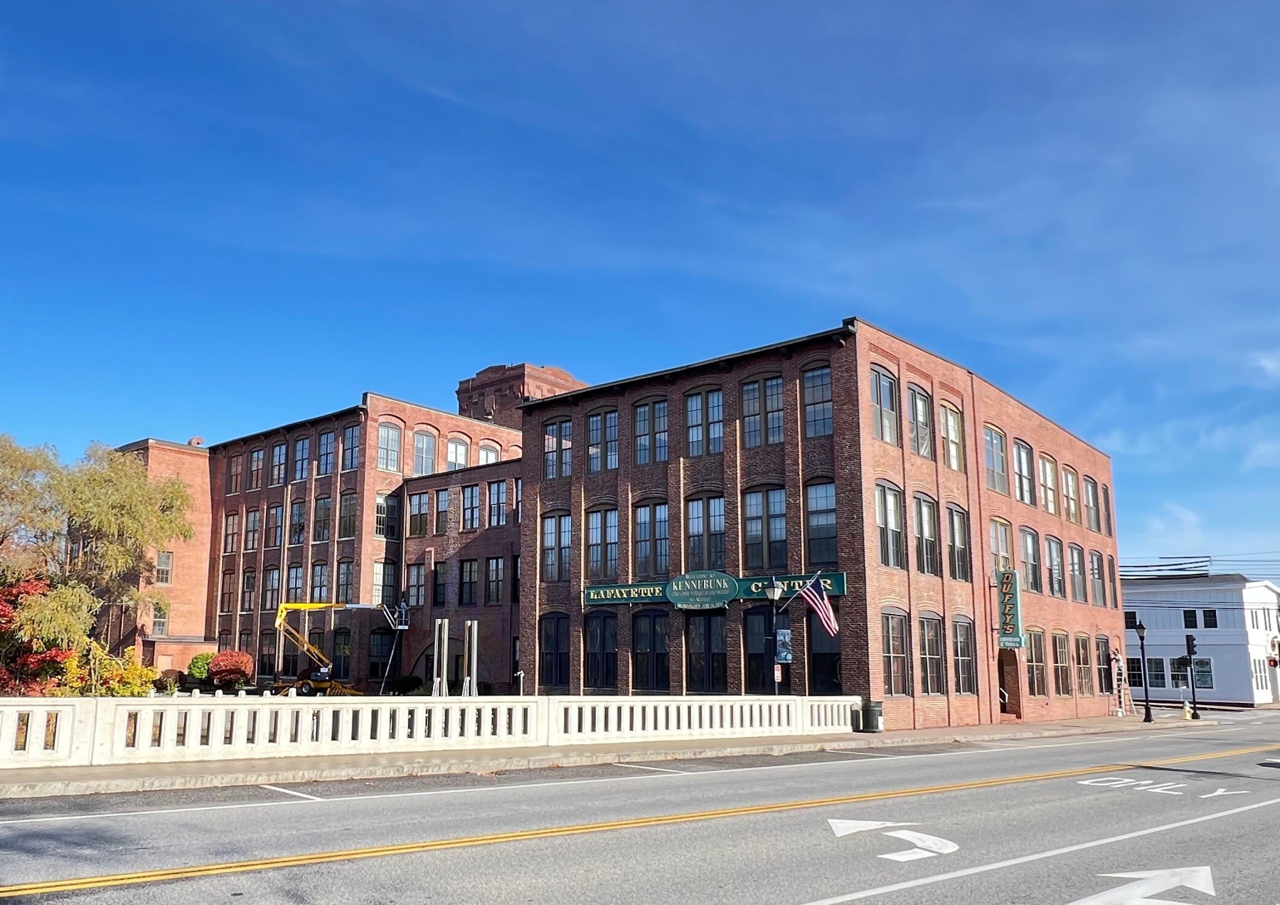 An exterior view of a multi-store brick building.