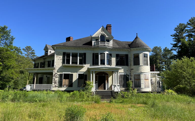 The old Gehring house with an unmowed lawn still needs exterior work.