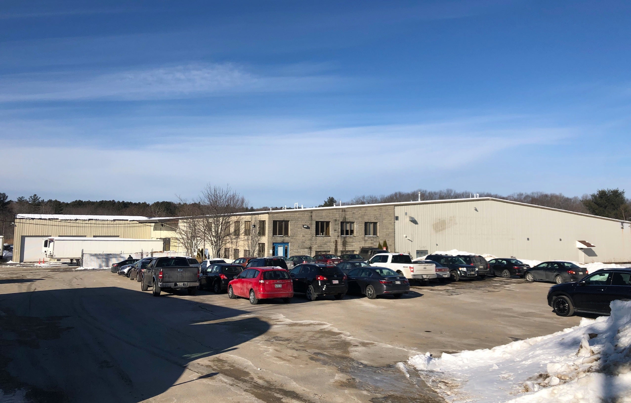 big low building and vehicles