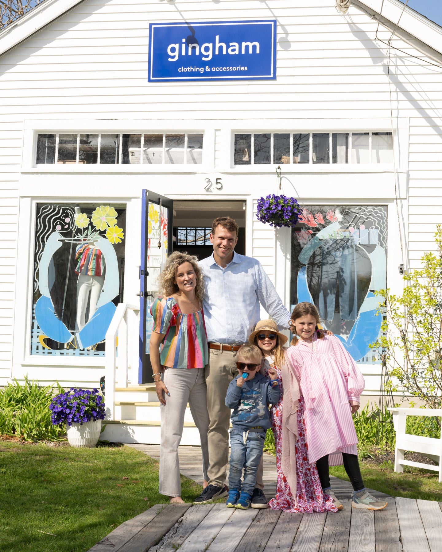 The family that bought 25 Bow St. in Freeport stands outside the store