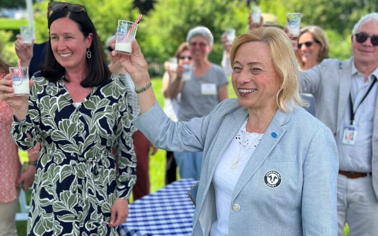 Mills and Beaks raising milk glasses