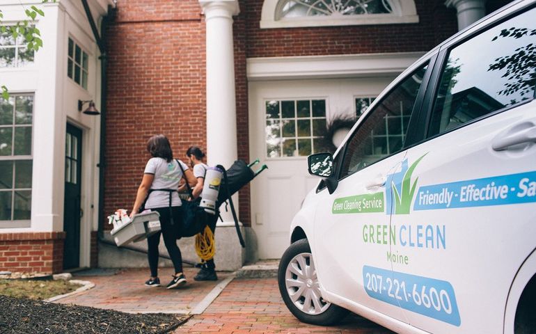 housecleaners walking from Green Clean van