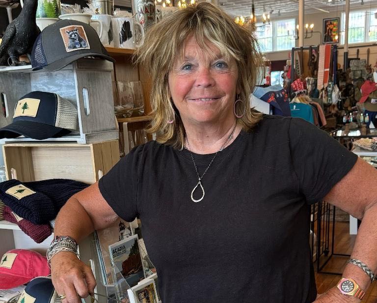 At Trio, the owner stands by display racks.