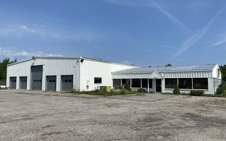 white building and parking lot
