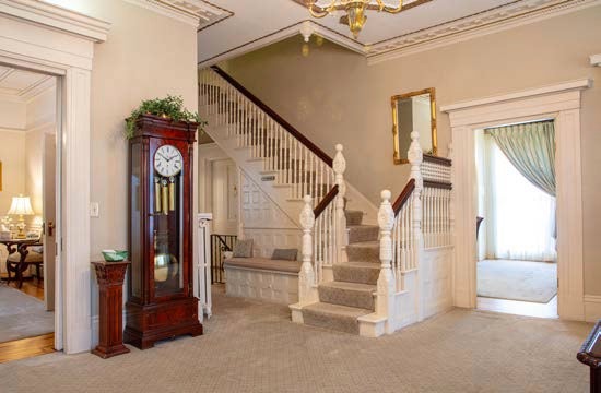 A room has a staircase and door openings.