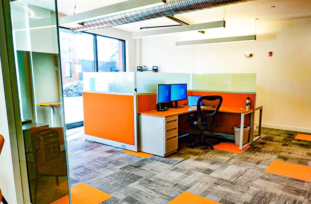 An office has big windows.