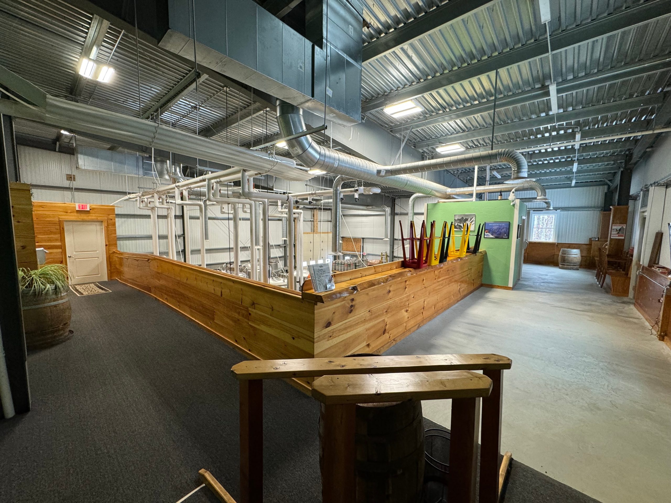 A view of a space with a counter and metal ceiling.