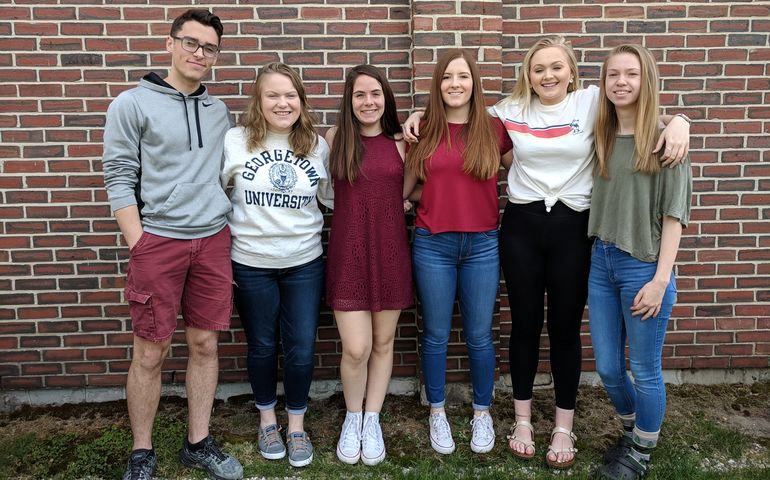 Six high school students about to earn an associate degree from Thomas College.