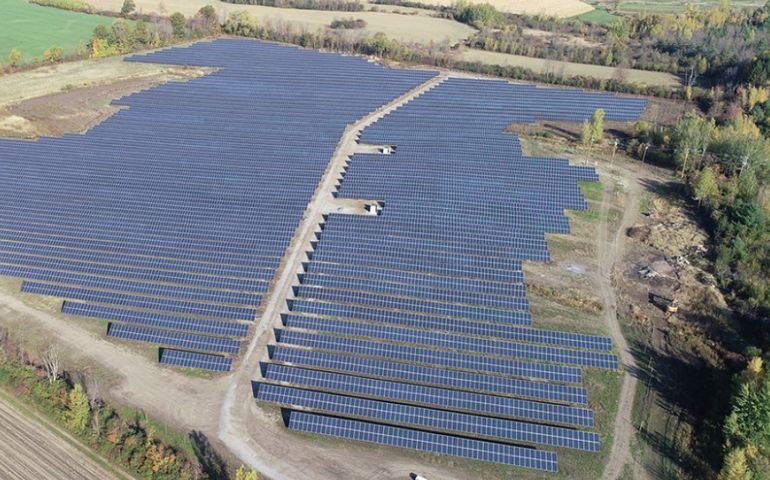 aerial view of large solar array on open field