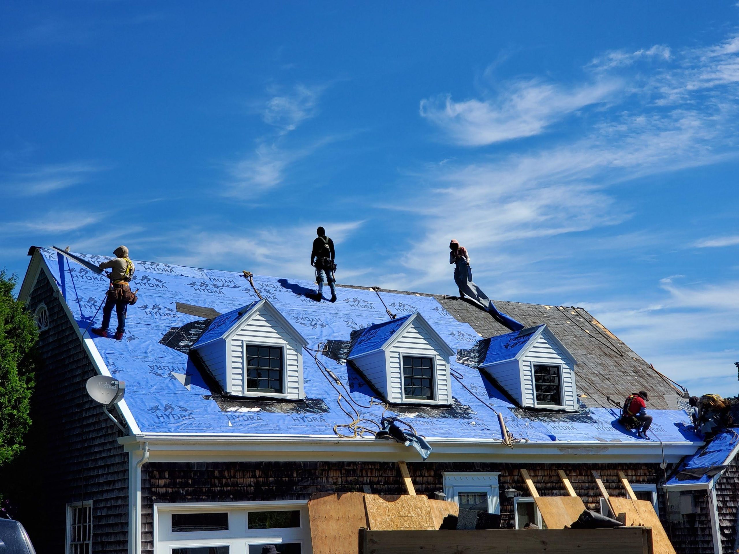 People are on top of a roof.