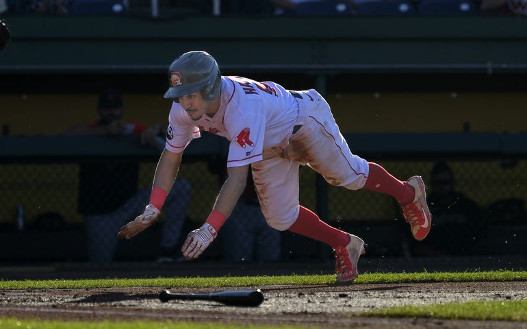 Baseball player diving on the field