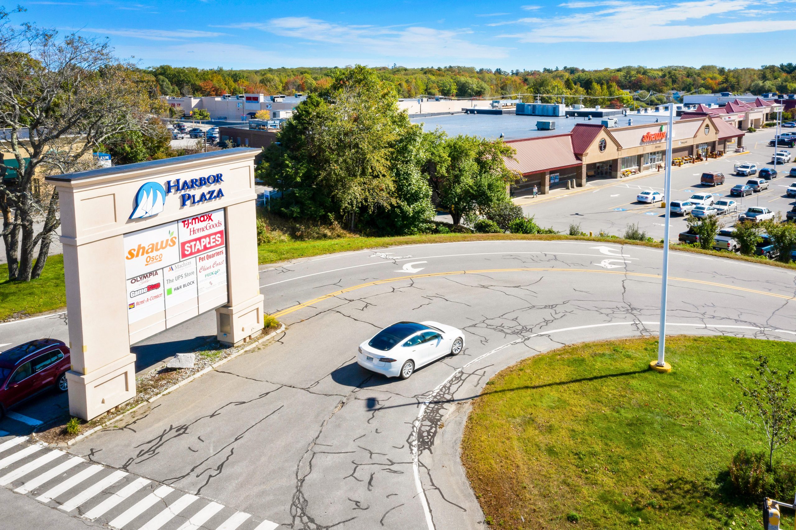 sign and buildings and car