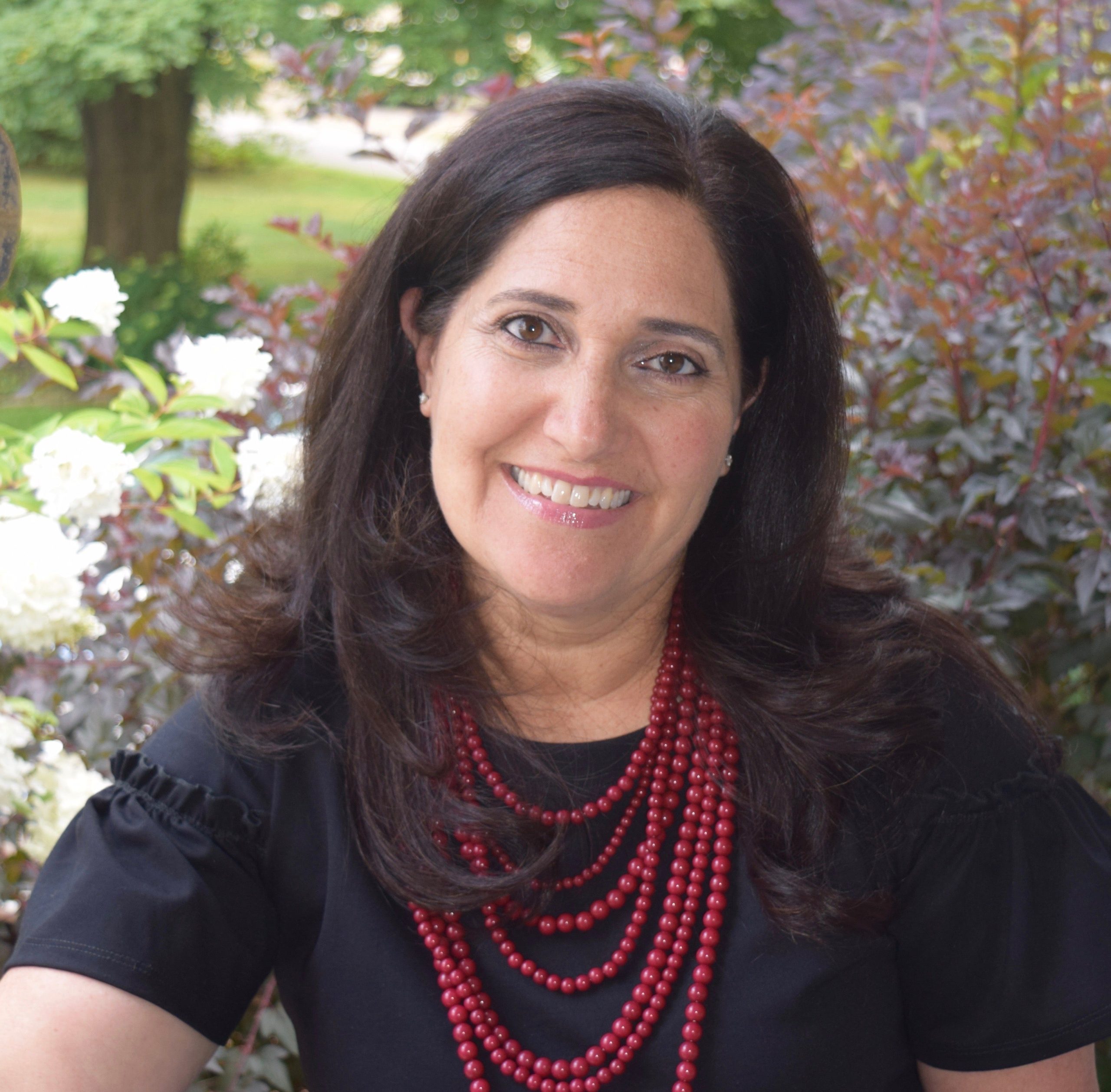 A person poses for a headshot.