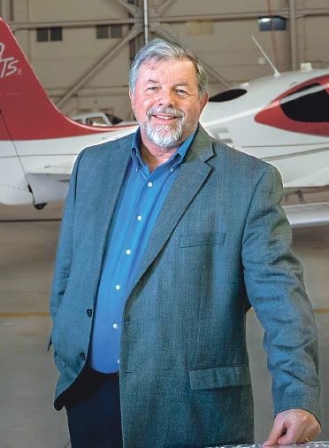 person smiling with plane