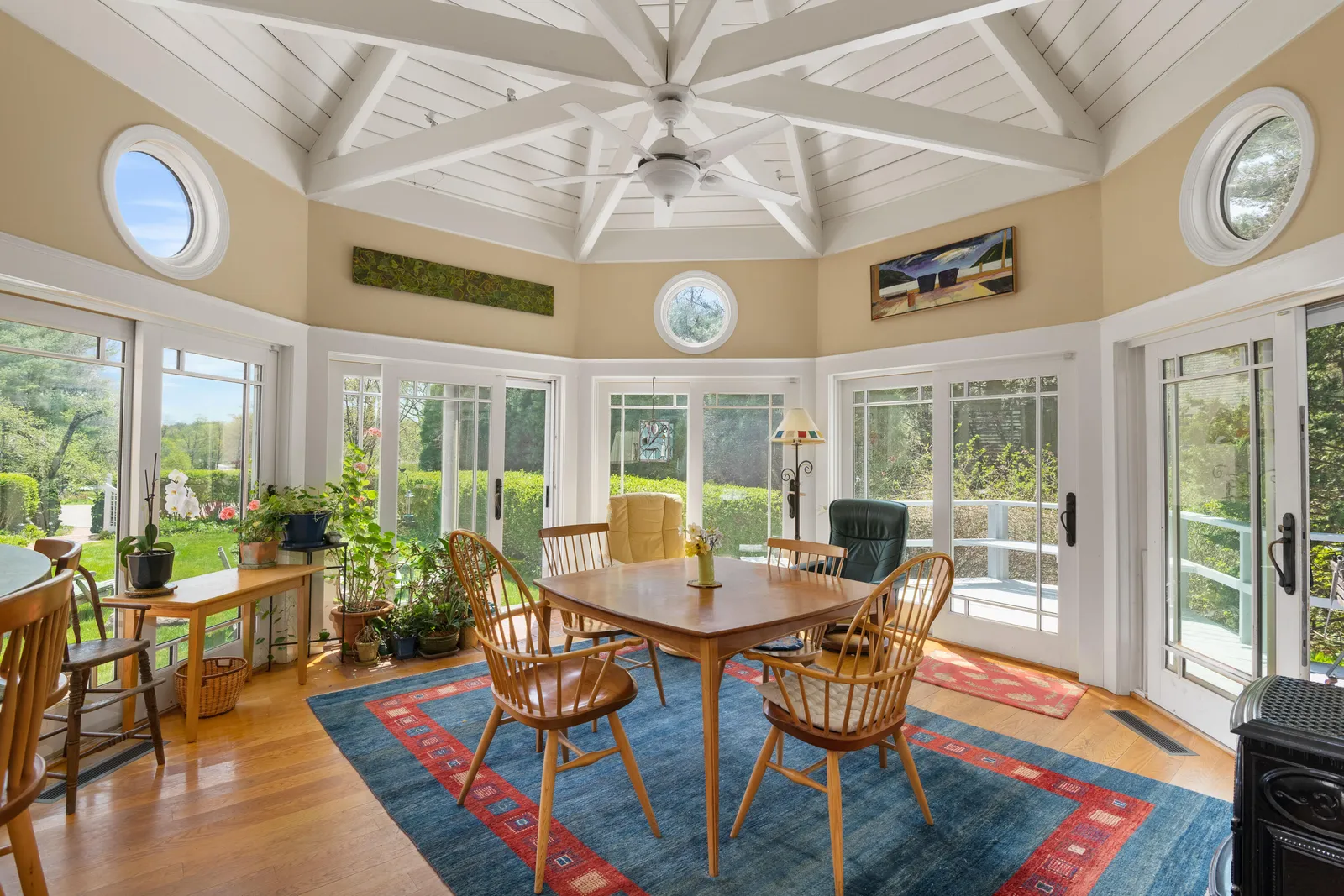 An octagonal room has lots of windows.