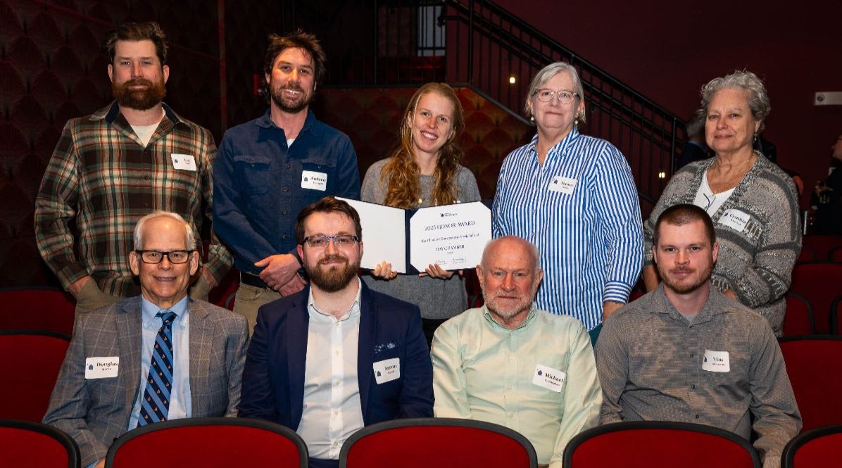 People pose for a group photo.