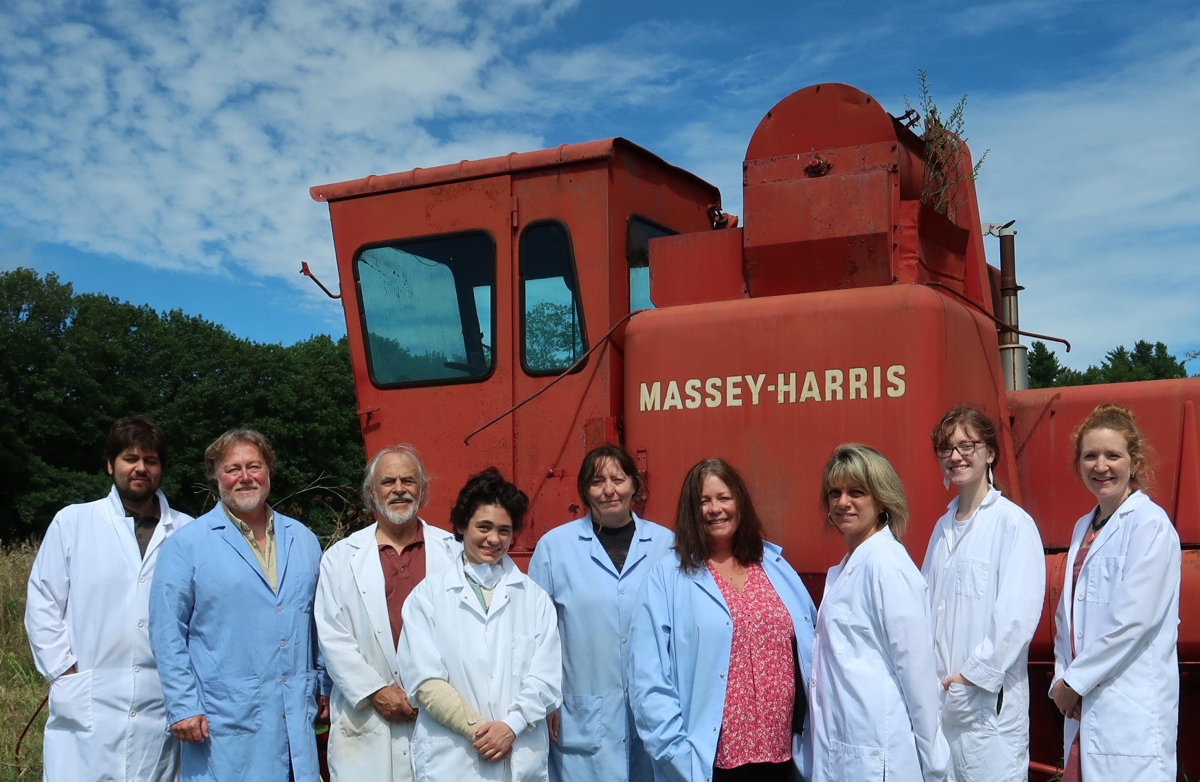 line of people with heavy equipment