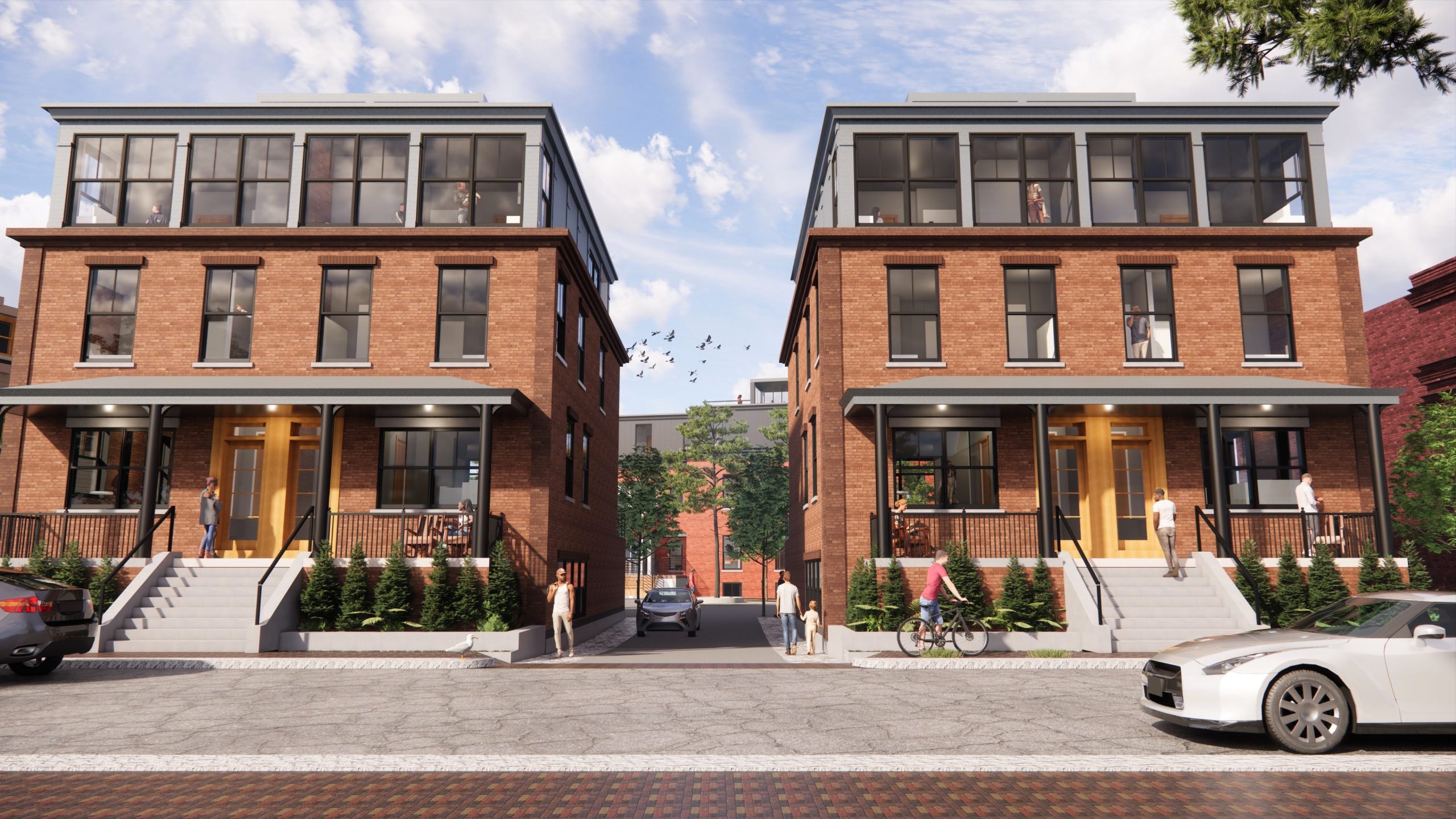 A rendering shows wwo brick buildings with another behind them.