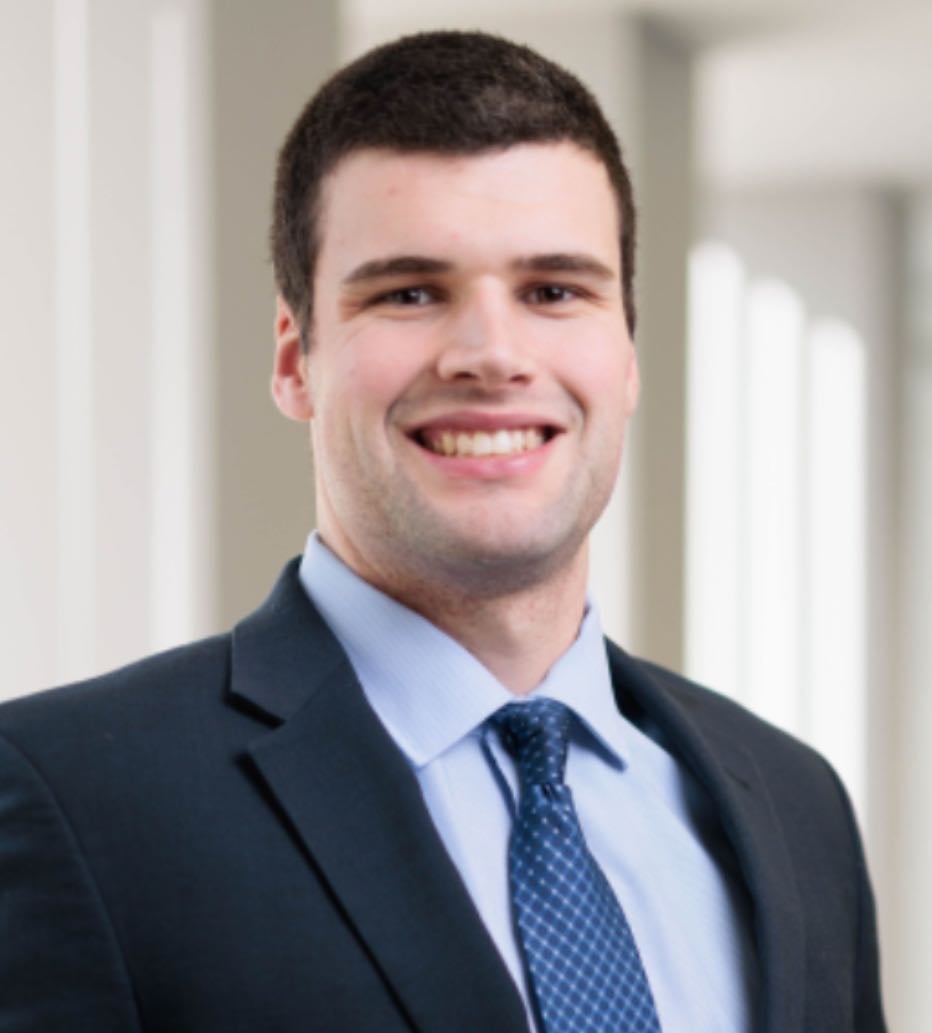 A person poses for a headshot.