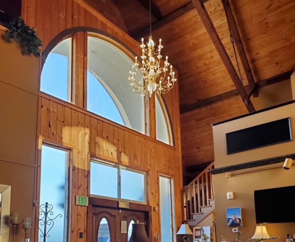 A room has a high ceiling.