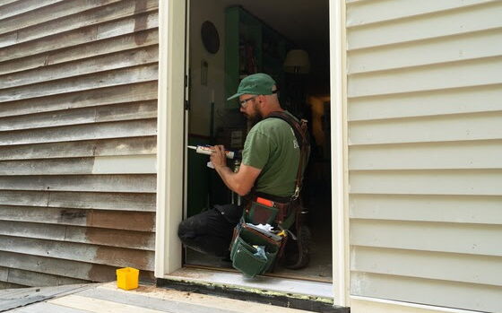 A person works on a house.