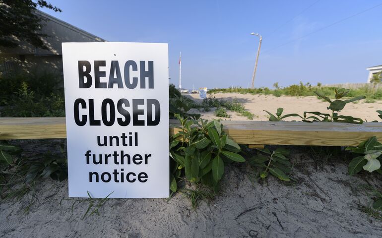Willard beach with sign saying 