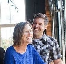 Two people pose for a photo.