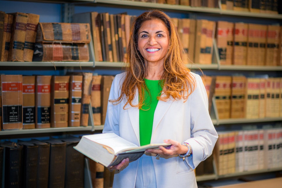 Kaveri Subbarao Nauhaus in front of law books at Bernstein Shur