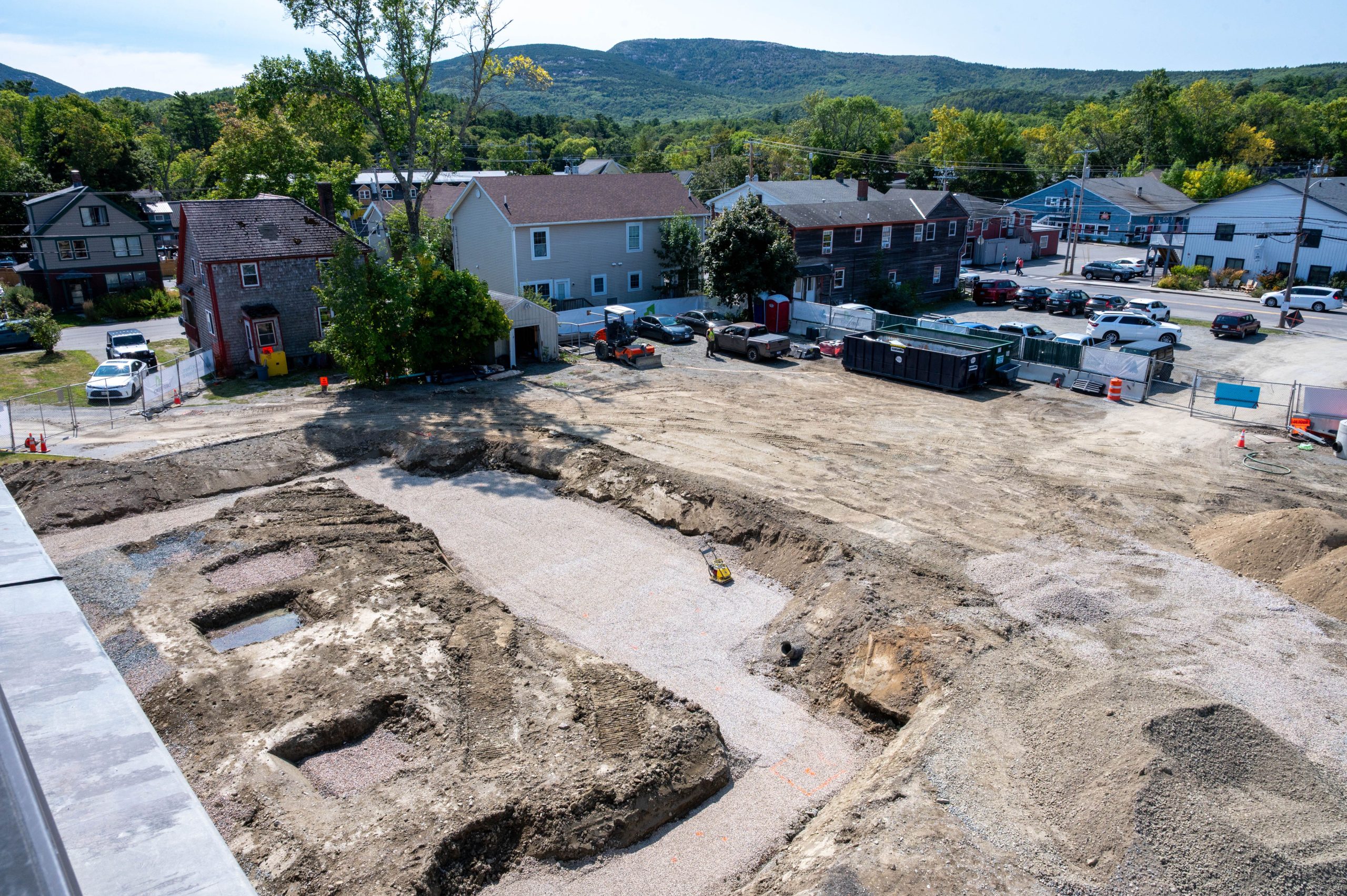 An aerial view shows a construction site.