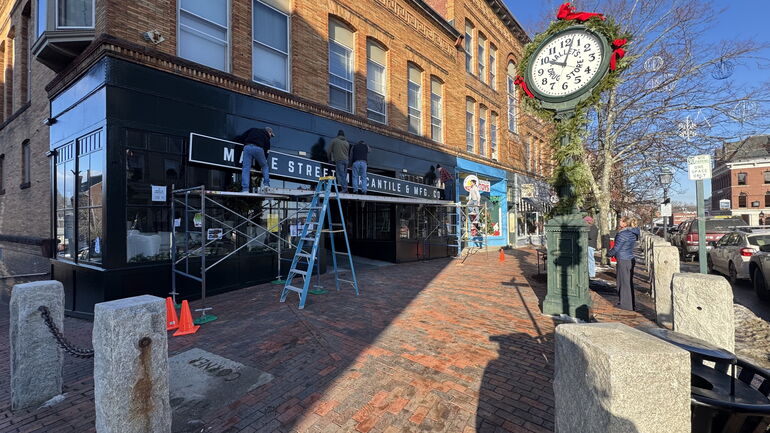 Sign being out on a building at 66 Front St. in Bath