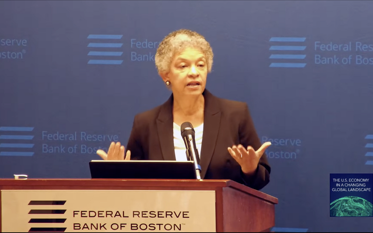 Susan Collins of the Boston Fed at podium.