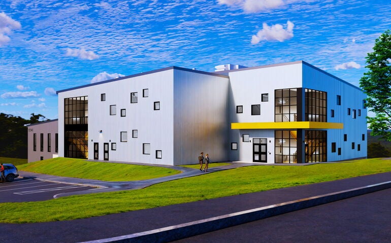 A picture shows the exterior of a  building with lots of windows.