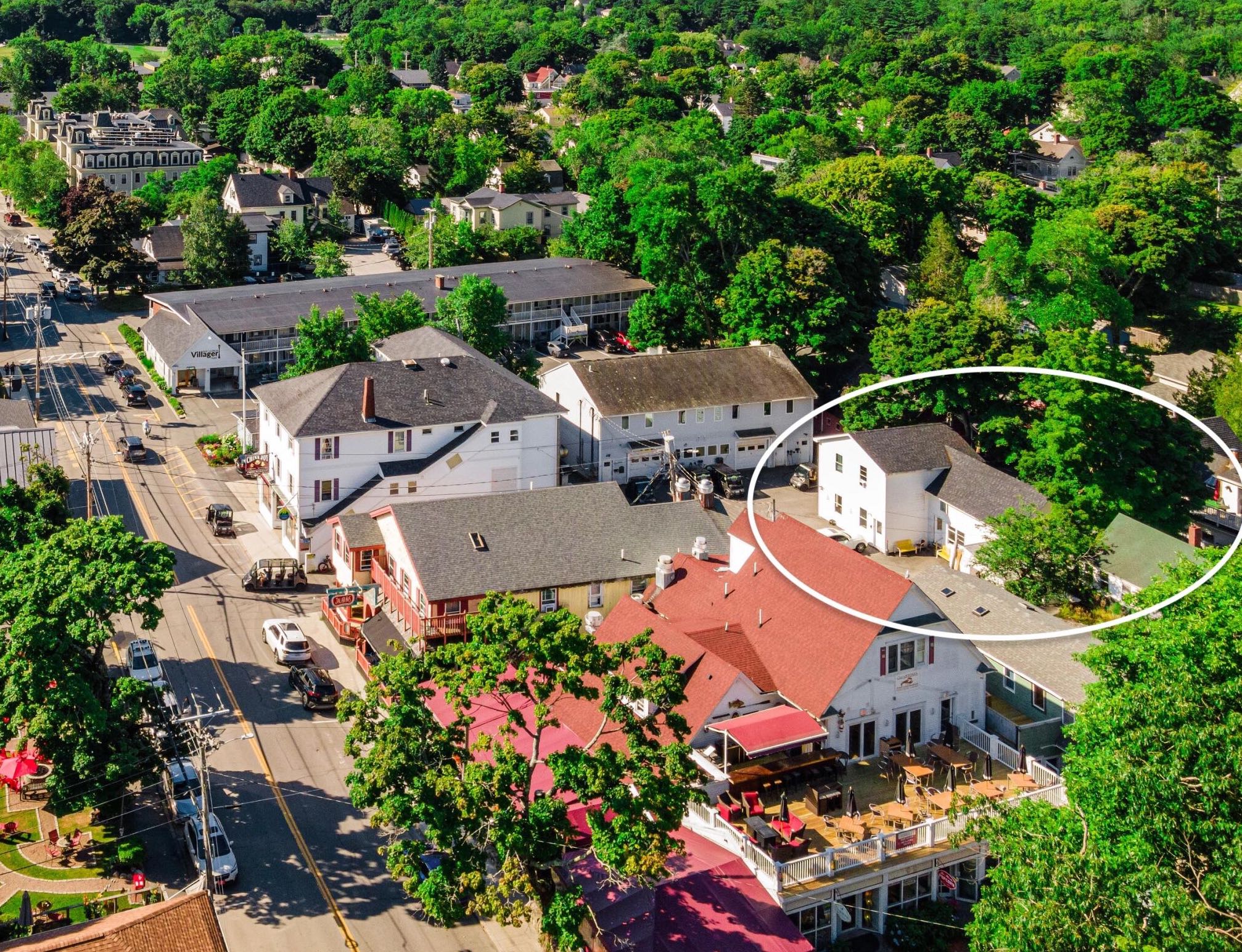 An aerial view shows buldings and a circle.
