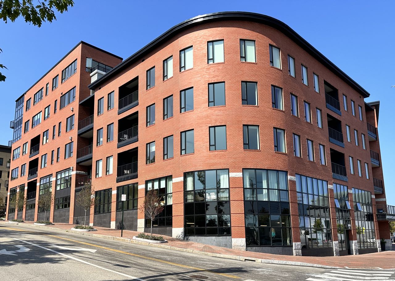 A building has a rounded corner.