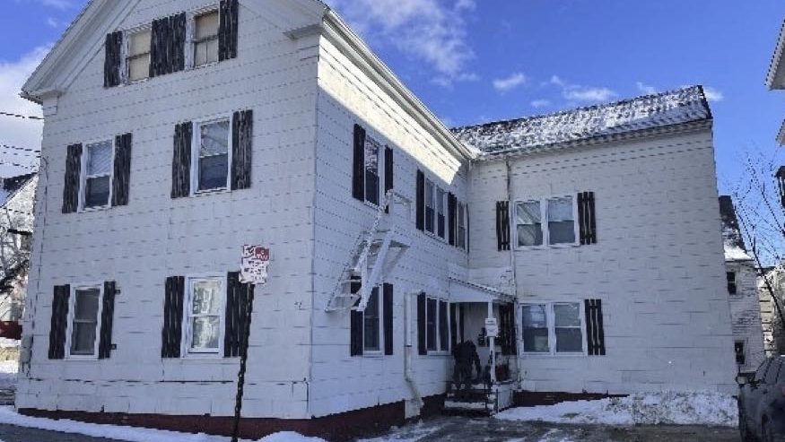 A house has white siding.