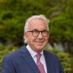 A person poses for a headshot.