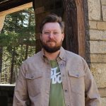 A person poses for a headshot.